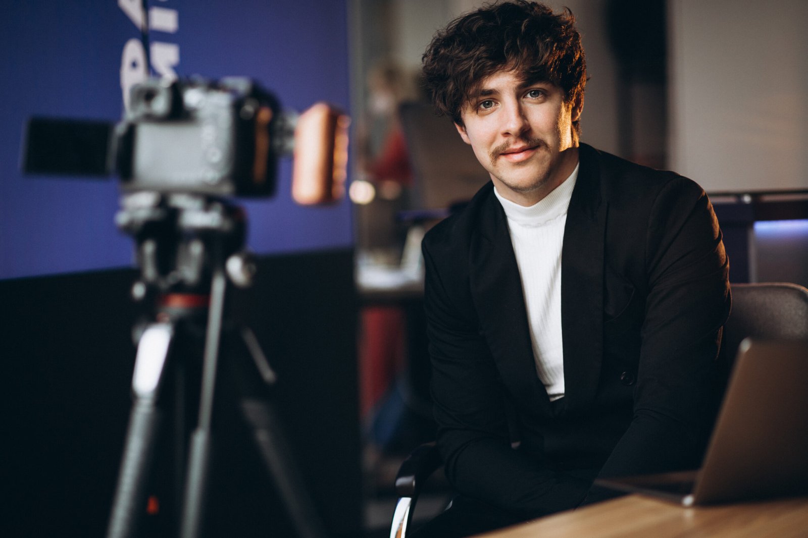 Young male blogger at a recording station